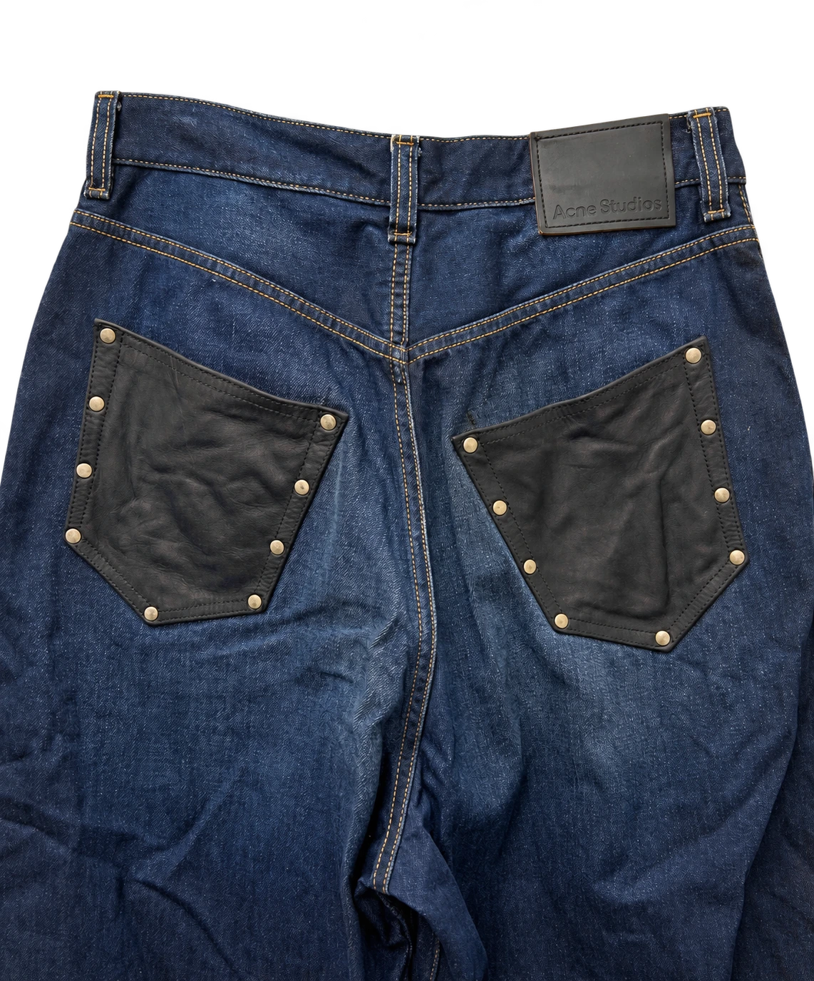 Acne Studios 2023M Leather-Pocket Baggy Jeans, Dark Blue, leather pockets and metal rivets detail; reference photograph
